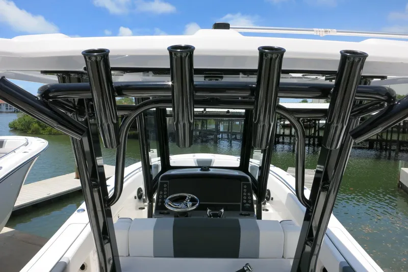 Slide: The Image of 2026 Robalo R270 Center Console boat with sleek design and advanced navigation system. - 13