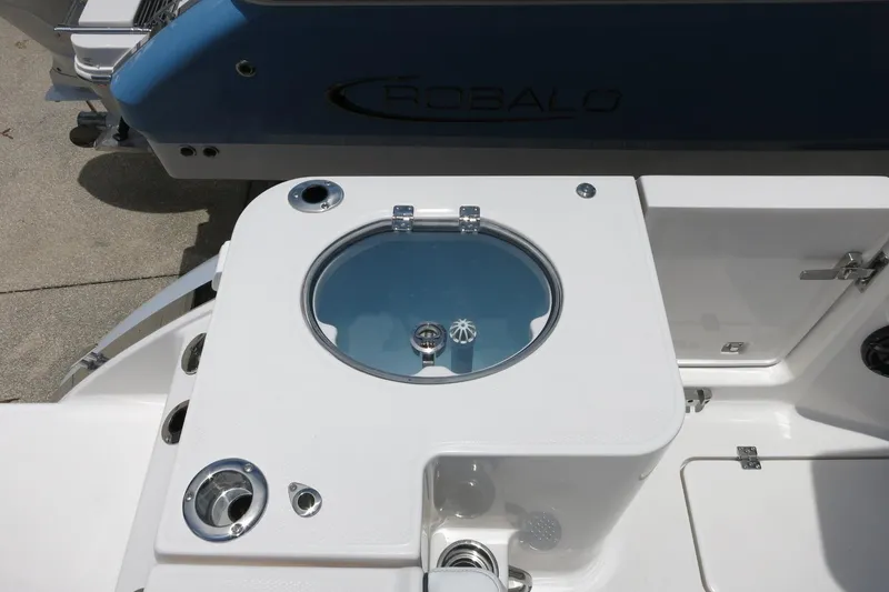 Slide: The Image of 2026 Robalo R270 Center Console boat with livewell and storage compartments. - 48