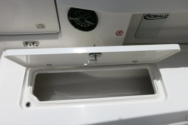 Slide: The Image of Open storage compartment on 2026 Robalo R270 Center Console boat. - 17