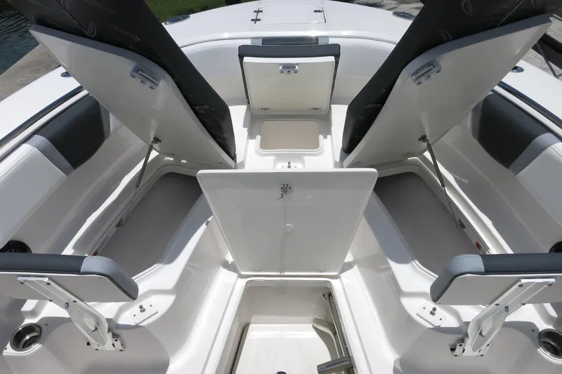 Slide: The Image of 2026 Robalo R270 Center Console boat interior with open storage compartments. - 60