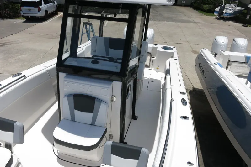 Slide: The Image of 2026 Robalo R270 Center Console boat with sleek design and spacious seating. - 63
