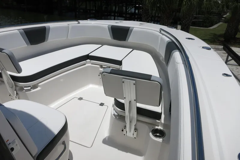 Slide: The Image of 2026 Robalo R270 Center Console boat interior with sleek seating and modern design. - 56