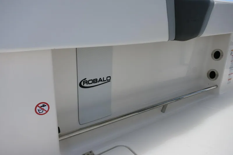 Slide: The Image of 2026 Robalo R270 Center Console boat interior detail with logo and safety features. - 33