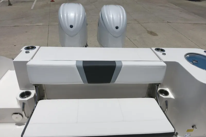Slide: The Image of 2026 Robalo R270 Center Console boat with dual engines and seating area. - 54