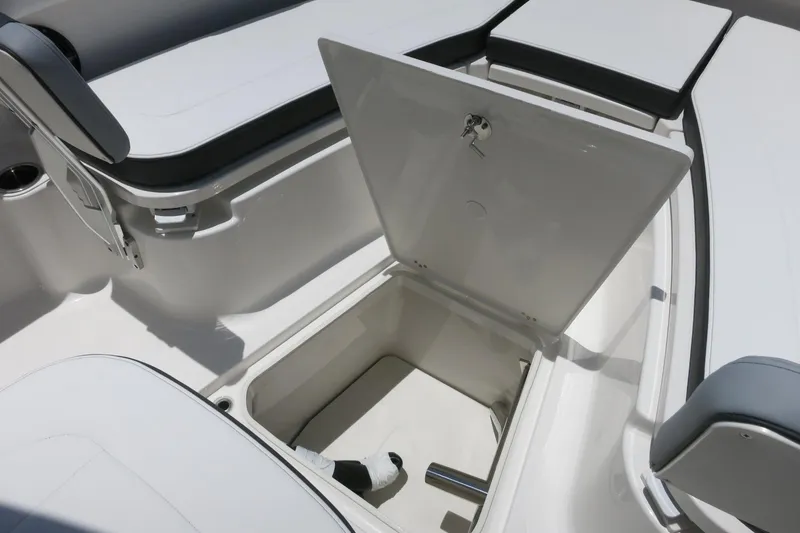 Slide: The Image of 2026 Robalo R270 Center Console boat with open storage compartment and seating. - 23