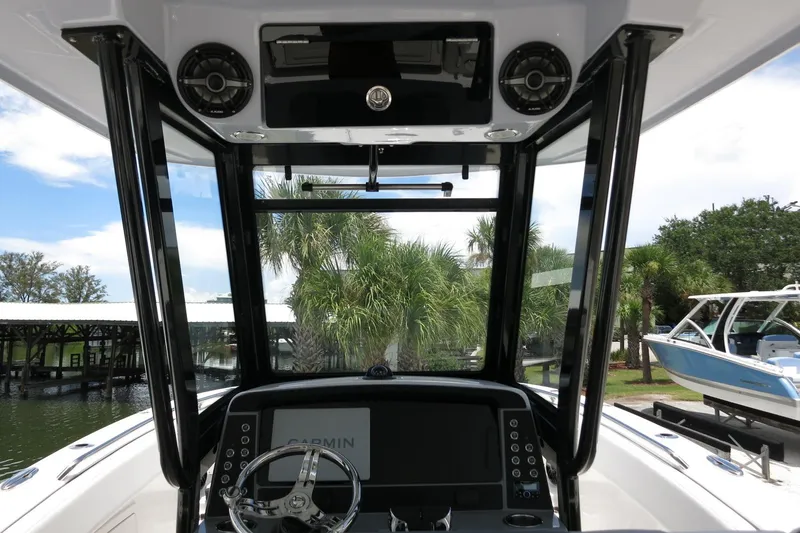 Slide: The Image of 2026 Robalo R270 Center Console boat interior with advanced navigation system and sleek design. - 55