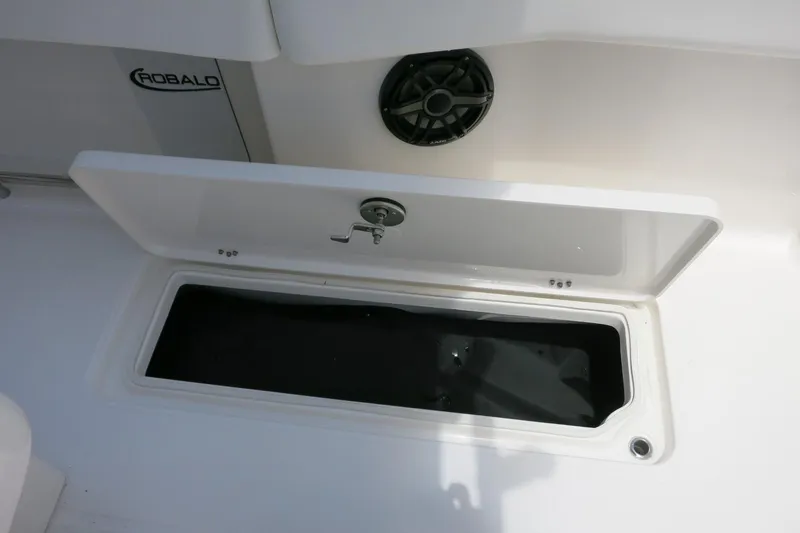 Slide: The Image of Open storage compartment on 2026 Robalo R270 Center Console boat. - 18