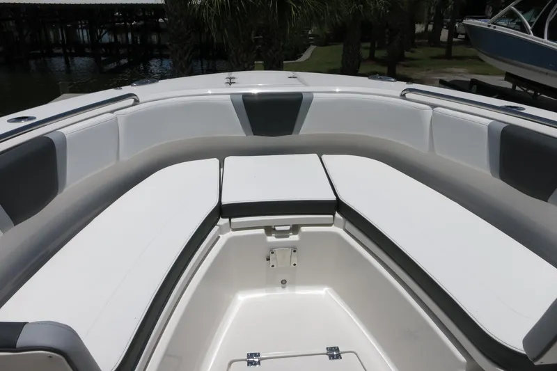 Slide: The Image of 2026 Robalo R270 Center Console boat with spacious seating area and sleek design. - 59