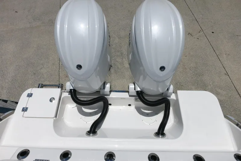 Slide: The Image of 2026 Robalo R270 Center Console with dual outboard engines, viewed from above. - 70