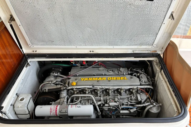 Slide: The Image of Yanmar diesel engine in a 2005 Marlow 375 boat, showcasing detailed mechanical components. - 44