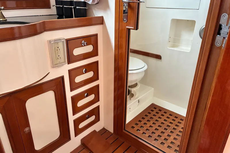 Slide: The Image of Luxurious Marlow 375 yacht bathroom with wooden cabinetry and modern fixtures, 2005 model. - 37