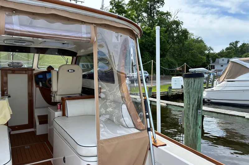 Slide: The Image of Interior view of a 2005 Marlow 375 boat docked at a marina. - 4
