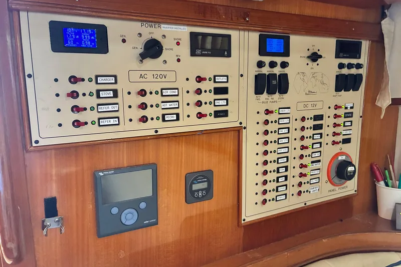 Slide: The Image of Electrical control panel on a 2005 Marlow 375 boat, featuring AC and DC systems. - 42