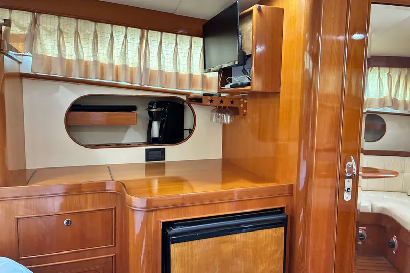 Slide: The Image of Interior of a 2005 Marlow 375 yacht with wood cabinetry and modern amenities. - 31