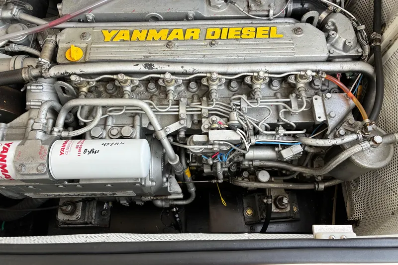 Slide: The Image of Yanmar diesel engine in a 2005 Marlow 375 boat, showcasing intricate mechanical components. - 45