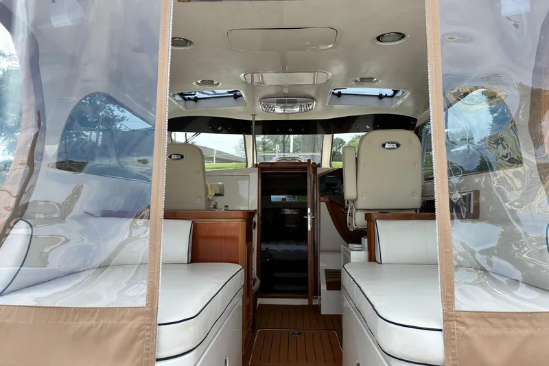 Slide: The Image of Interior view of a 2005 Marlow 375 boat with seating and helm. - 14