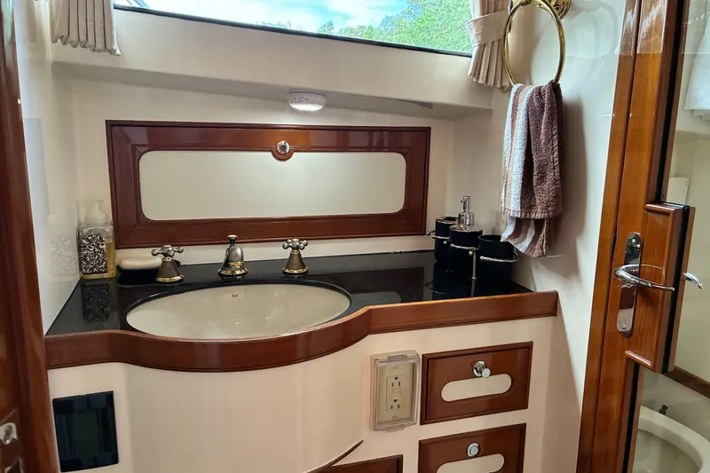 Slide: The Image of Luxurious Marlow 375 yacht bathroom with elegant wood accents and modern fixtures, 2005 model. - 34