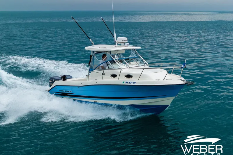 The Image of 2004 Hydra-Sports Vector 2800 WA cruising on open water, showcasing sleek design and performance. - 1