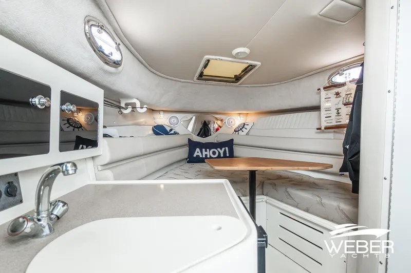 Slide: The Image of Interior of 2004 Hydra-Sports Vector 2800 WA boat with cozy seating and nautical decor. - 15