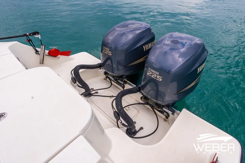 Slide: The Image of 2004 Hydra-Sports Vector 2800 WA with twin Yamaha 225 engines on turquoise water. - 13