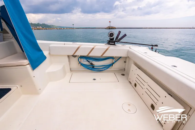 Slide: The Image of 2004 Hydra-Sports Vector 2800 WA boat deck with fishing equipment and ocean view. - 24