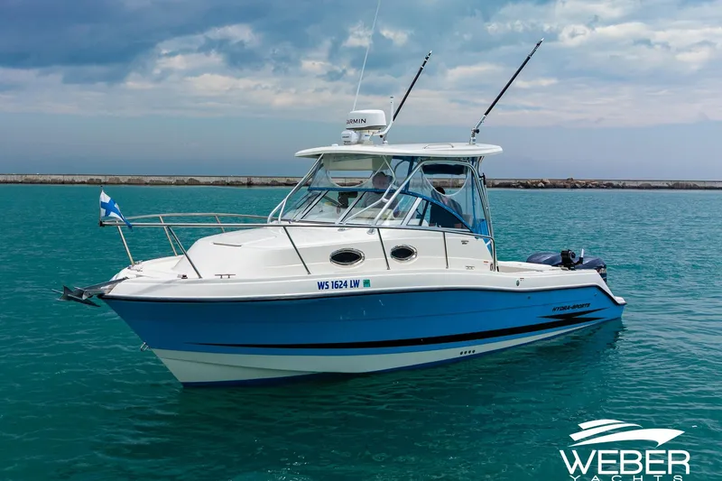 Slide: The Image of 2004 Hydra-Sports Vector 2800 WA boat on calm water under cloudy sky. - 31