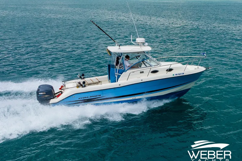 Slide: The Image of 2004 Hydra-Sports Vector 2800 WA cruising on open water, showcasing sleek design and performance. - 27