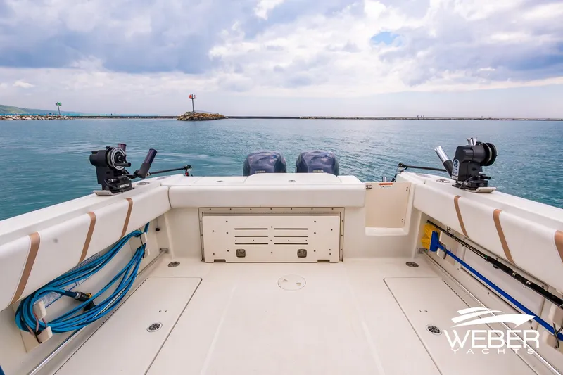Slide: The Image of 2004 Hydra-Sports Vector 2800 WA boat deck with fishing equipment, ocean view. - 22