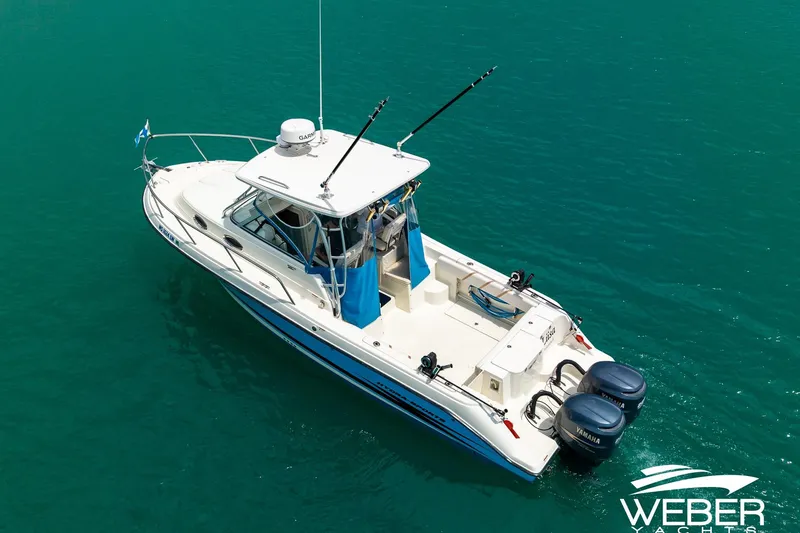 Slide: The Image of 2004 Hydra-Sports Vector 2800 WA boat on clear turquoise water. - 30