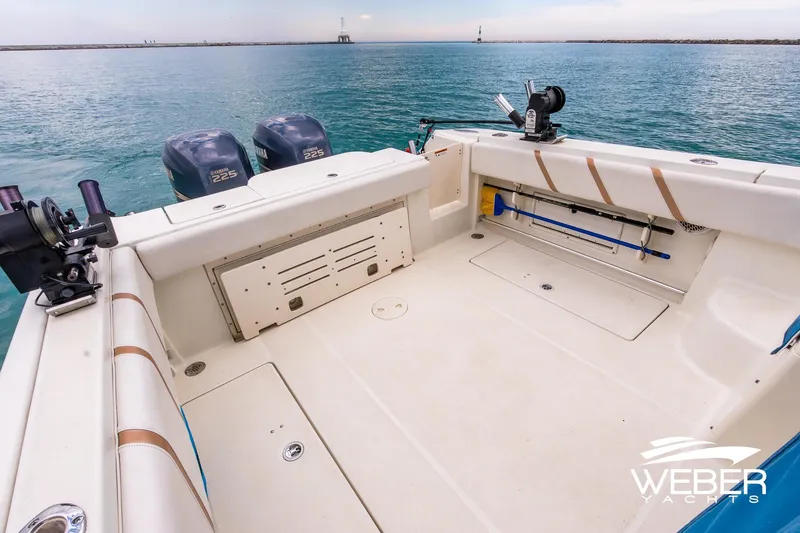 Slide: The Image of 2004 Hydra-Sports Vector 2800 WA boat deck with dual Yamaha 225 engines on calm water. - 23