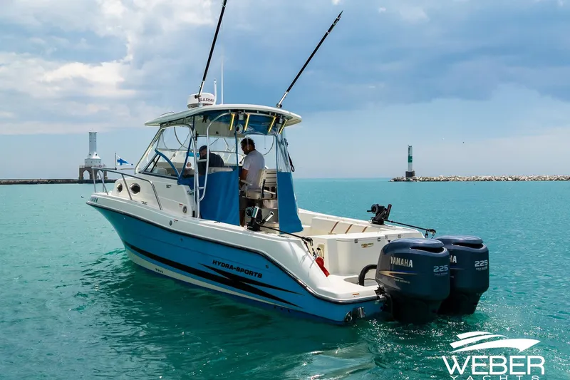 Slide: The Image of 2004 Hydra-Sports Vector 2800 WA boat on turquoise water near lighthouse. - 29