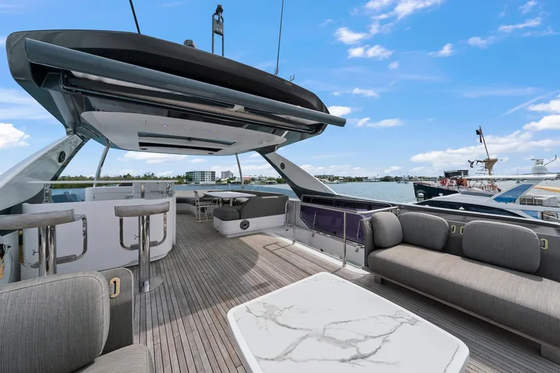 Slide: The Image of Luxurious 2020 Azimut Fly 78 yacht deck with modern seating and ocean view. - 34