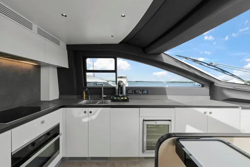 Slide: The Image of Modern kitchen interior on 2020 Azimut Fly 78 yacht with sleek design and ocean view. - 48