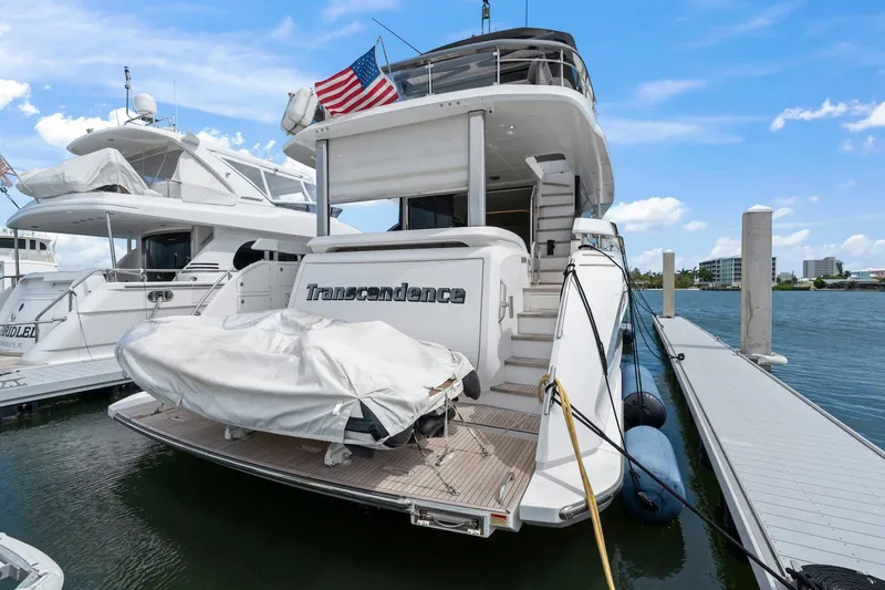 Slide: The Image of Azimut Fly 78 yacht docked, rear view, with American flag, 2020 model. - 17