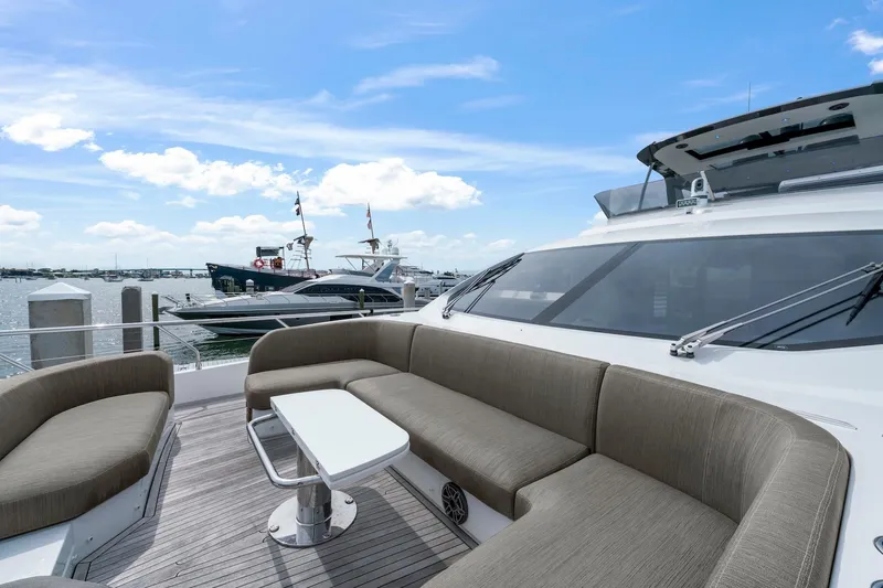 Slide: The Image of Luxurious 2020 Azimut Fly 78 yacht with spacious outdoor seating, docked at marina. - 8