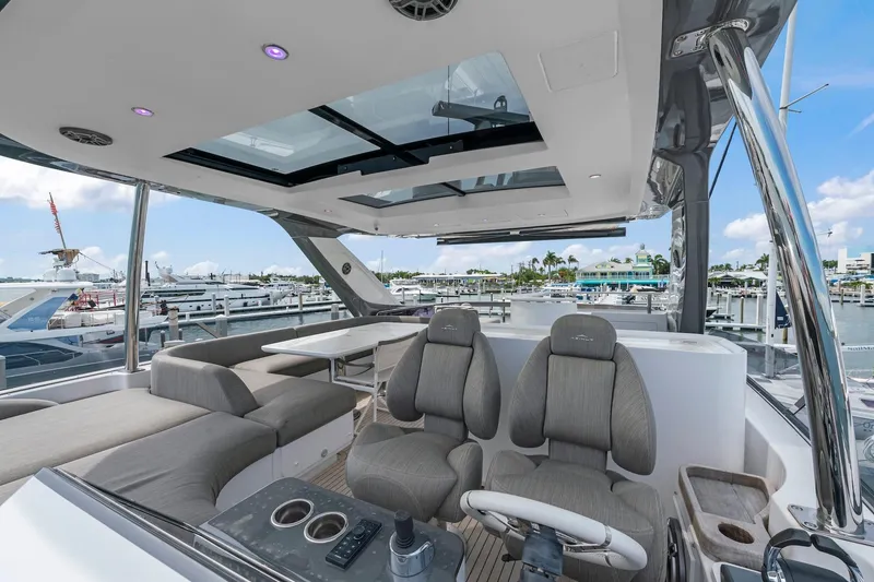 Slide: The Image of Luxurious 2020 Azimut Fly 78 yacht interior with modern seating and panoramic marina view. - 46