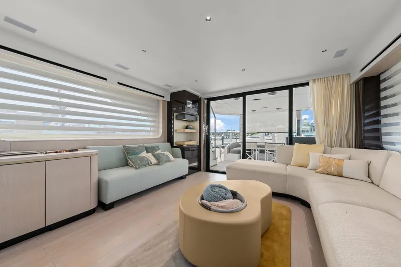 Slide: The Image of Luxurious interior of 2020 Azimut Fly 78 yacht with modern seating and large windows. - 63