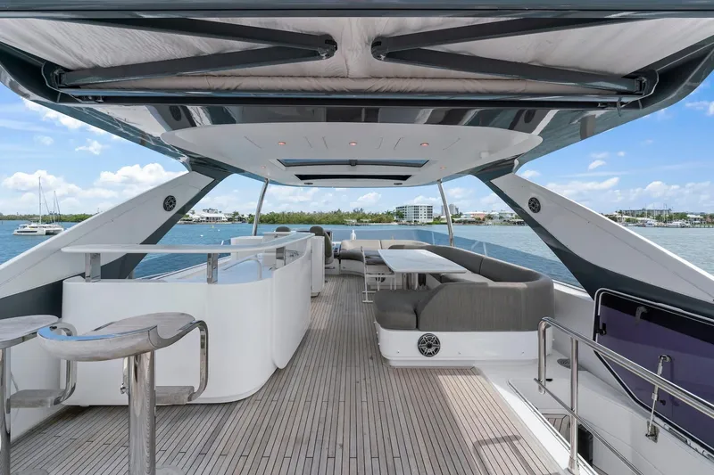 Slide: The Image of Luxurious 2020 Azimut Fly 78 yacht deck with modern seating and ocean view. - 23