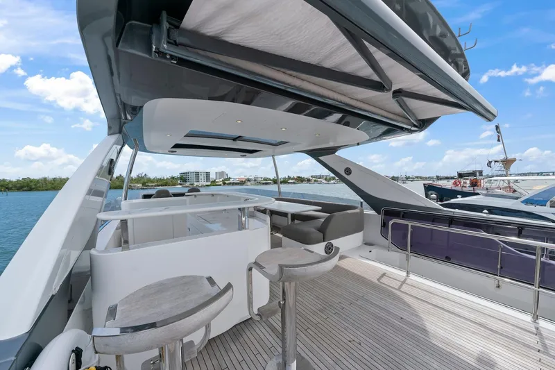 Slide: The Image of Luxurious 2020 Azimut Fly 78 yacht deck with modern seating and ocean view. - 24