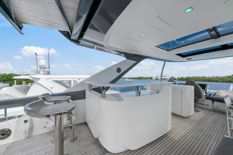 Slide: The Image of Luxurious 2020 Azimut Fly 78 yacht deck with modern seating and ocean view. - 36