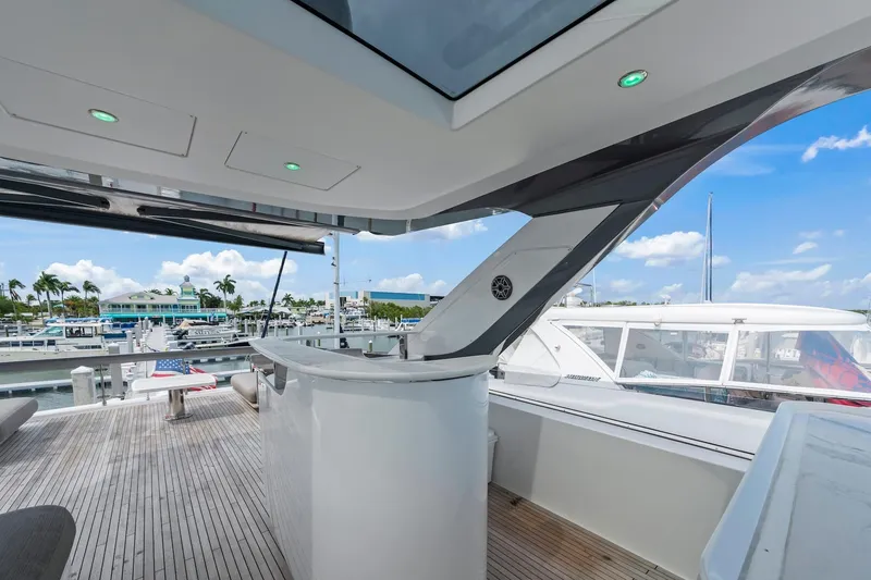 Slide: The Image of Luxurious 2020 Azimut Fly 78 yacht deck with marina view, featuring sleek design and modern amenities. - 40