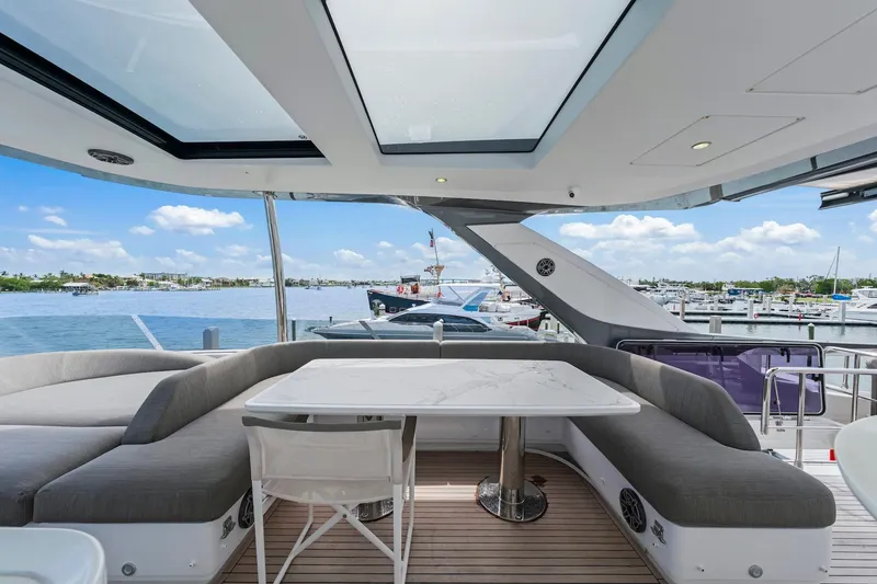 Slide: The Image of Luxurious 2020 Azimut Fly 78 yacht deck with seating and marina view. - 26