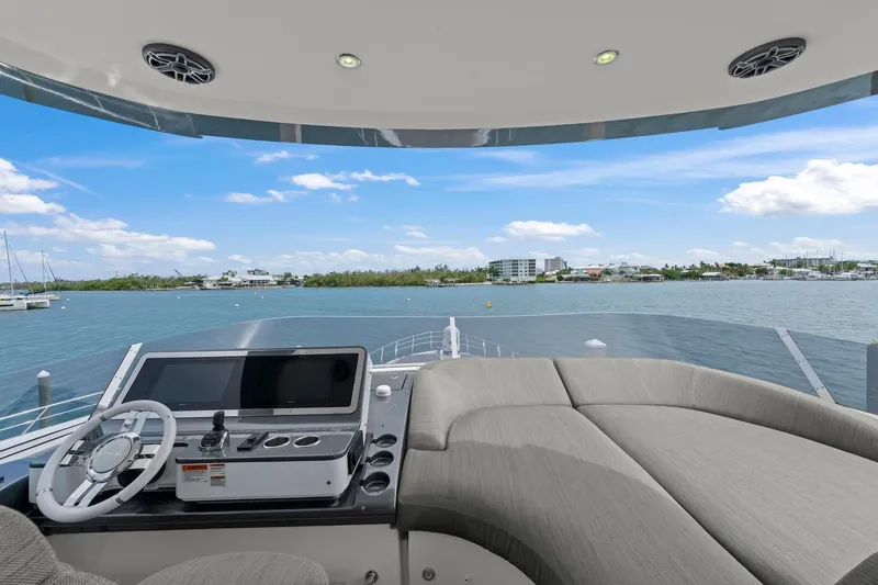 Slide: The Image of Luxurious 2020 Azimut Fly 78 yacht helm with scenic waterfront view. - 41