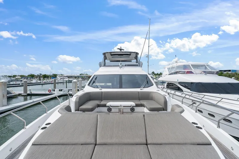 Slide: The Image of Azimut Fly 78 yacht, 2020 model, docked at marina under blue sky. - 2