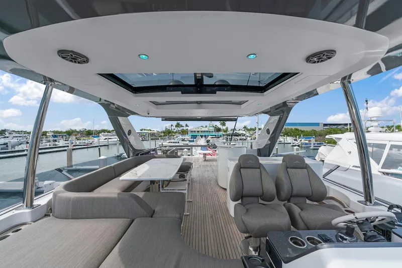 Slide: The Image of Luxurious 2020 Azimut Fly 78 yacht interior with plush seating and modern design at marina. - 45