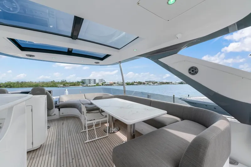 Slide: The Image of Luxurious 2020 Azimut Fly 78 yacht deck with elegant seating and scenic water views. - 25