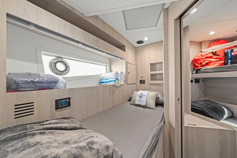 Slide: The Image of Luxurious cabin interior of 2020 Azimut Fly 78 yacht with modern amenities and cozy bedding. - 11