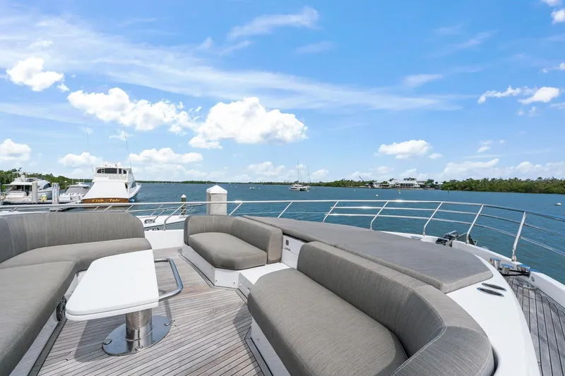 Slide: The Image of Luxurious 2020 Azimut Fly 78 yacht deck with elegant seating, overlooking serene waters. - 6
