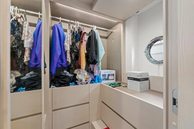 Slide: The Image of Spacious closet in 2020 Azimut Fly 78 yacht with clothes and accessories. - 78