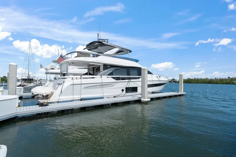 Slide: The Image of Luxury 2020 Azimut Fly 78 yacht docked on a sunny day. - 19